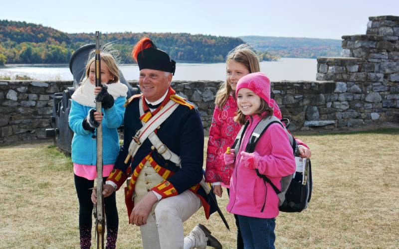 Soldier with three female students