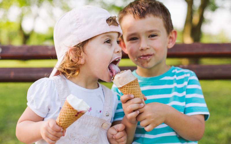 brother and sister eating ice cream