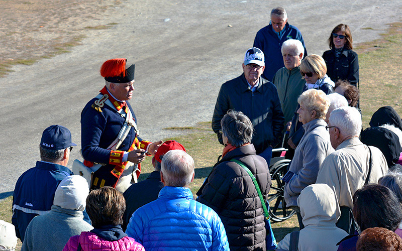 Re-enactor speaking to group
