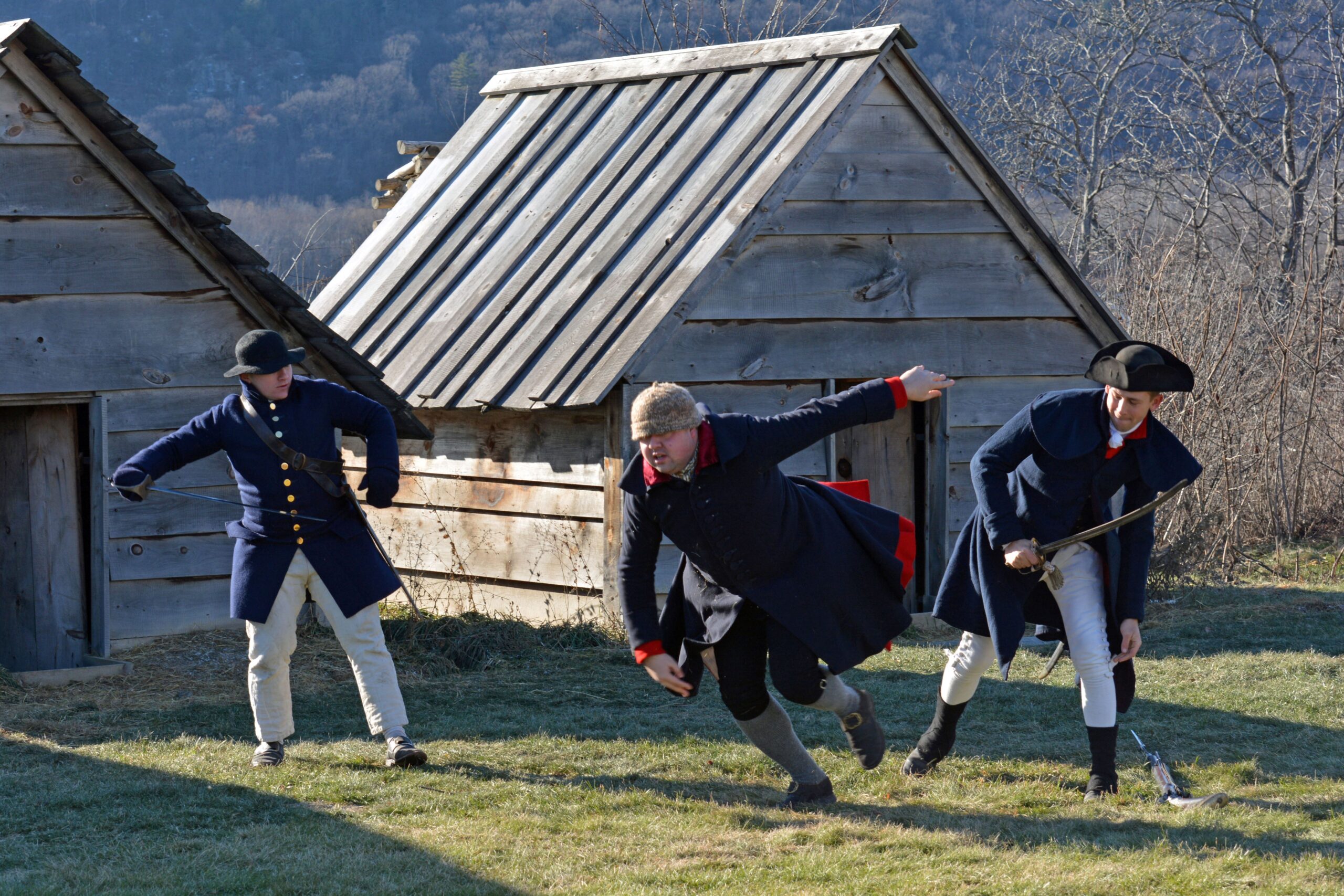 soldiers fighting in front of huts