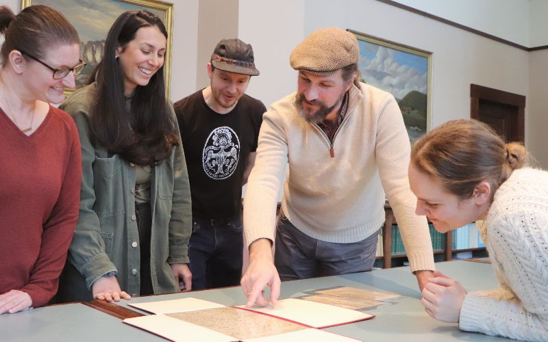 Photo of group looking at a document